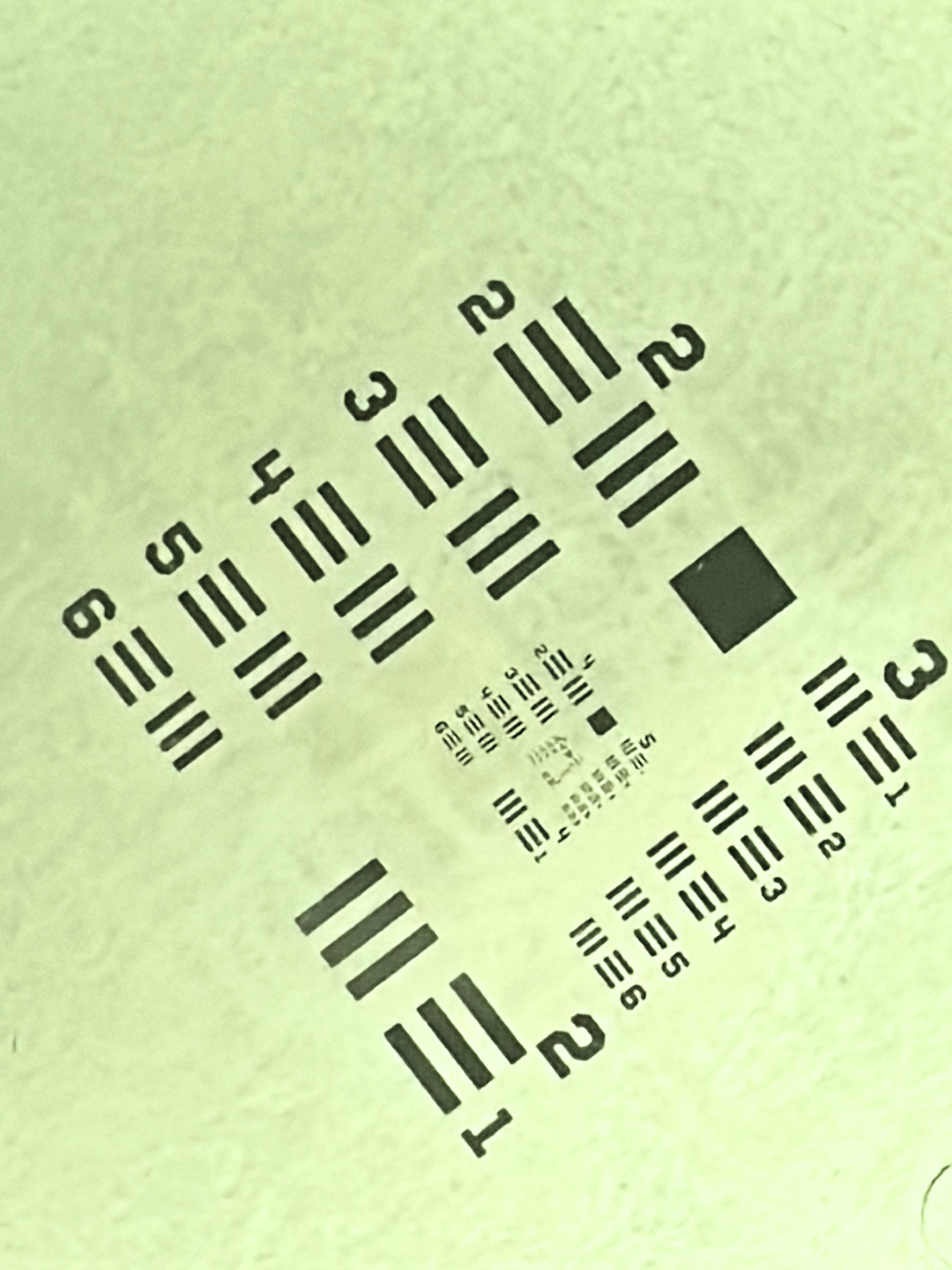 A printed resolution target photographed with Flacara